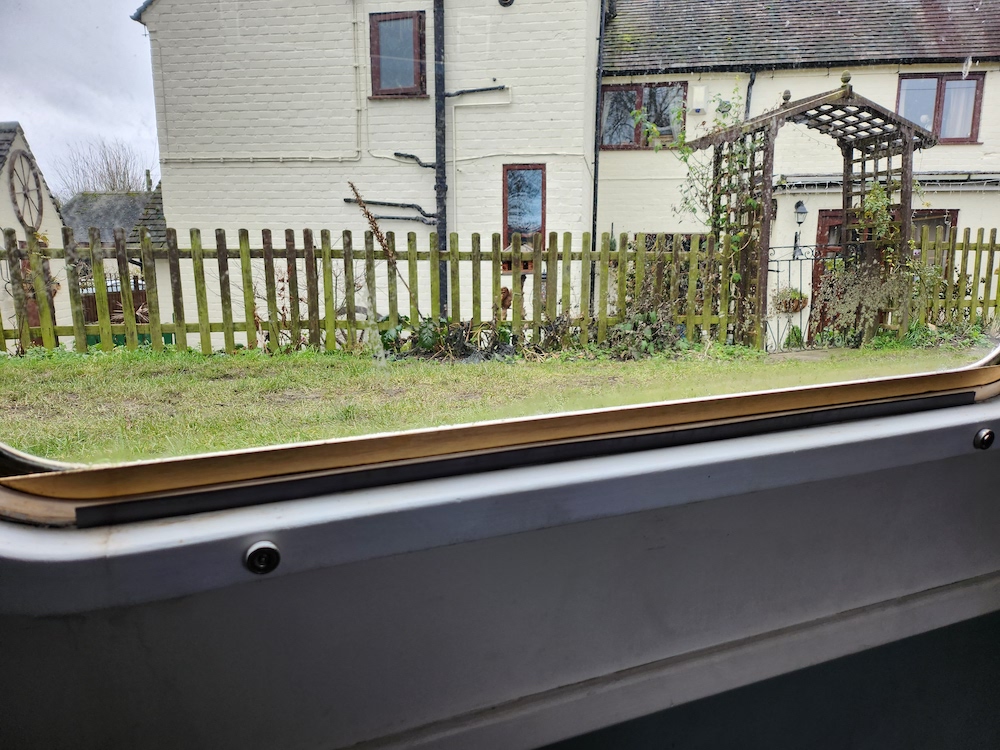 Magnetic strips attached to the window frame